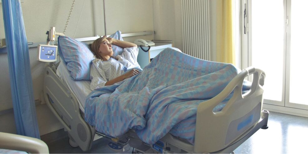 Woman in hospital bed