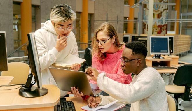 People looking at computer