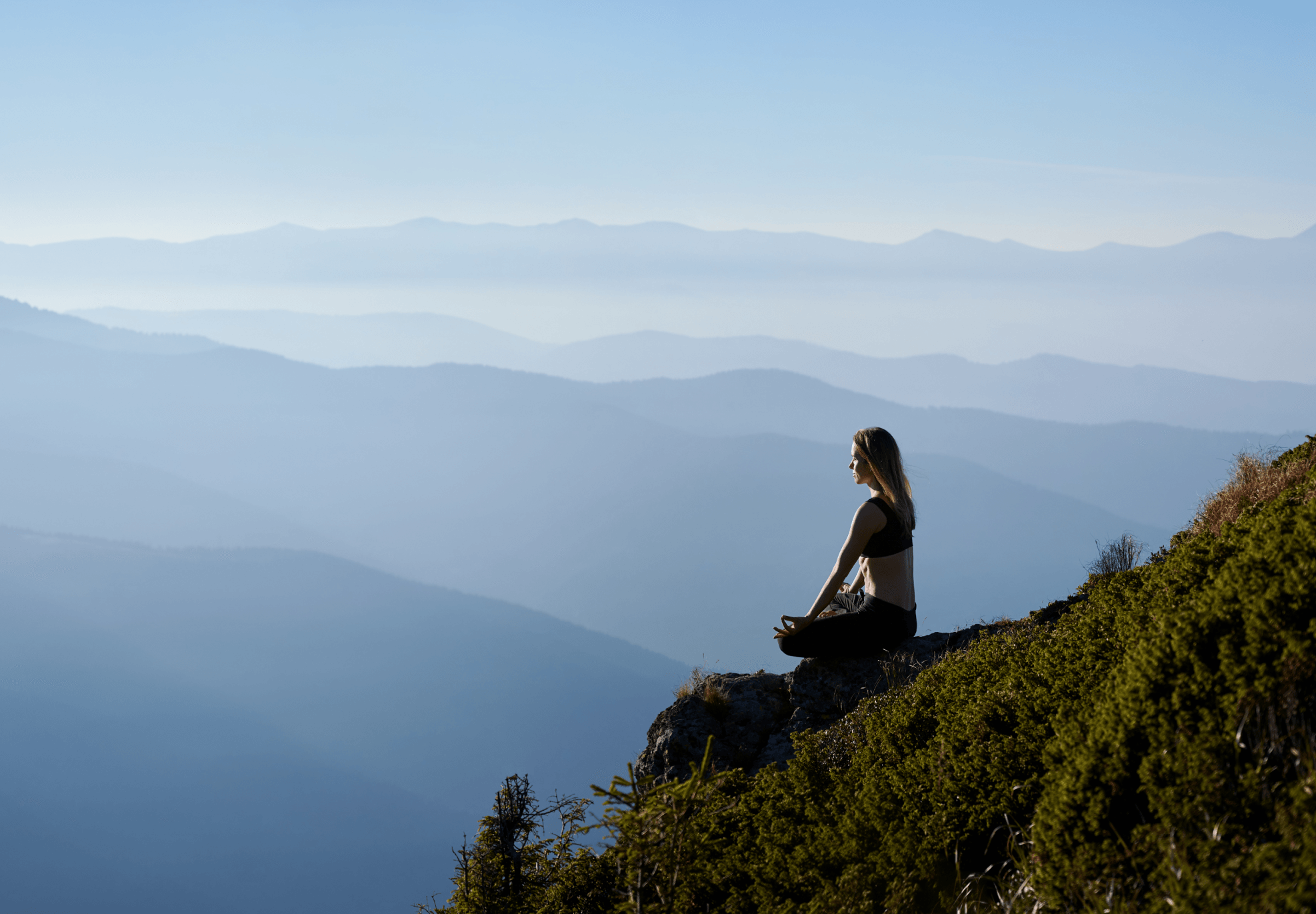 Person meditating in nature