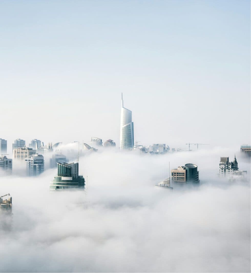 Skyscrapers above clouds